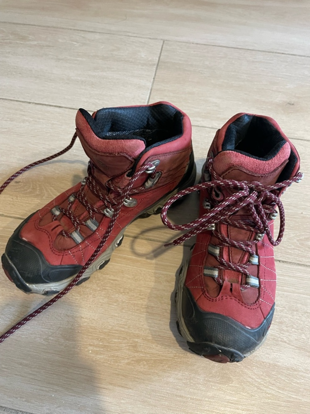 Oboz Women's Bridger Mid B-DRY hiking boots in a red colorway, size 6.5